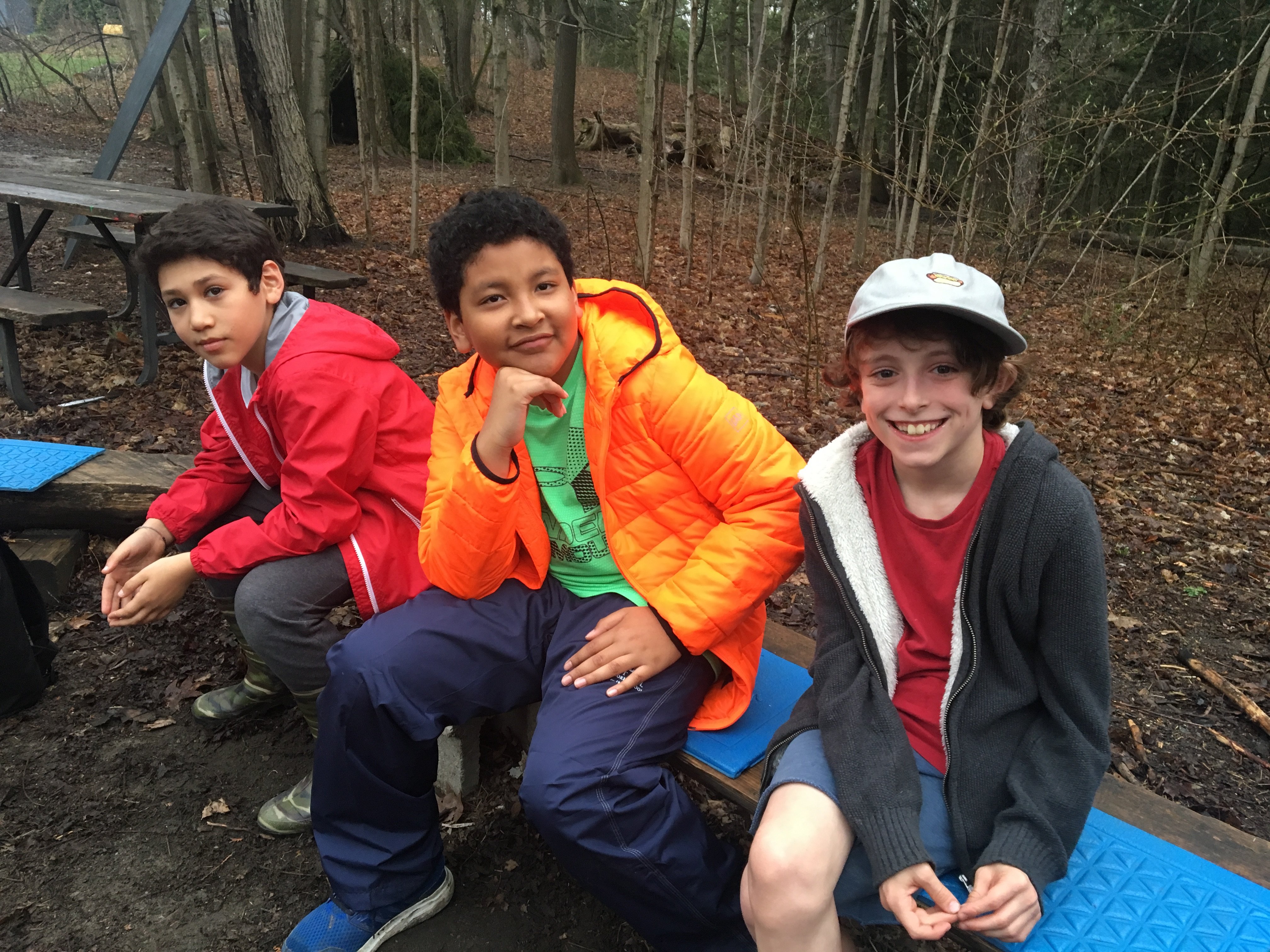 Smiling students in the woods