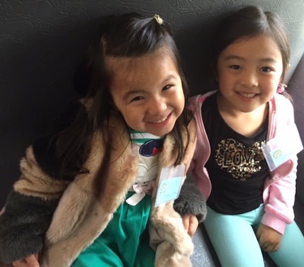 Students smiling on the bus