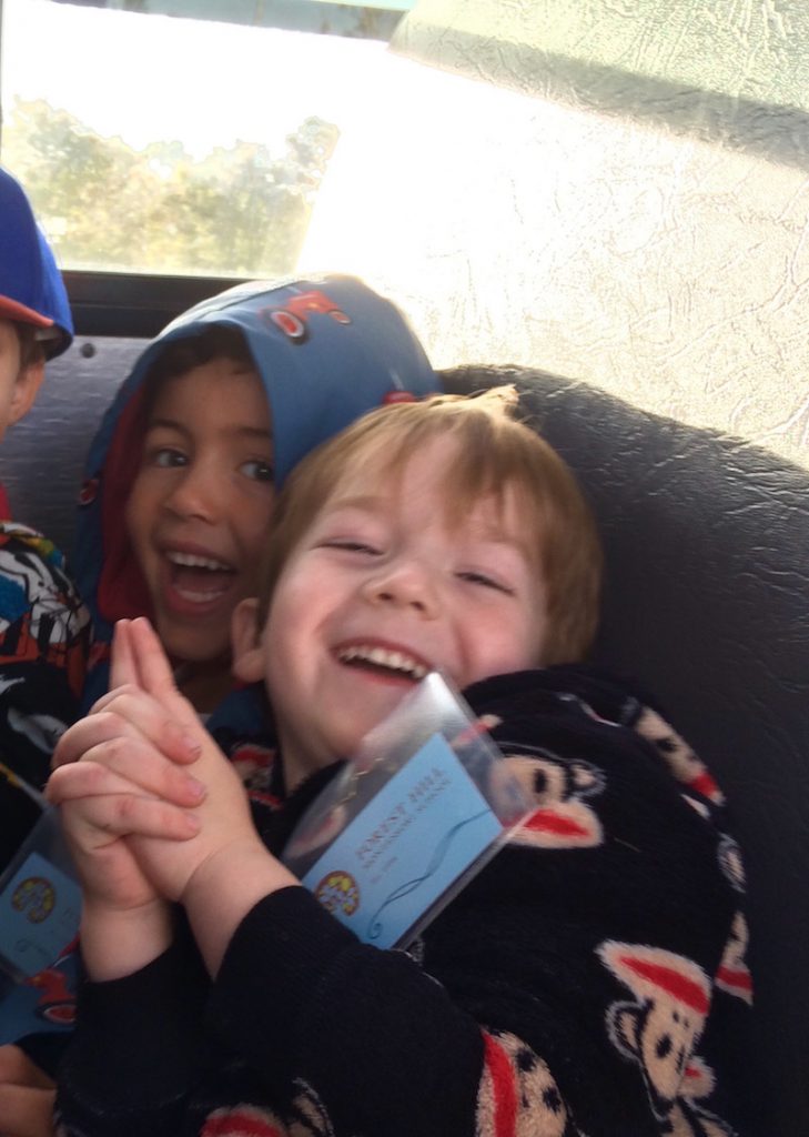 Smiling students on the bus