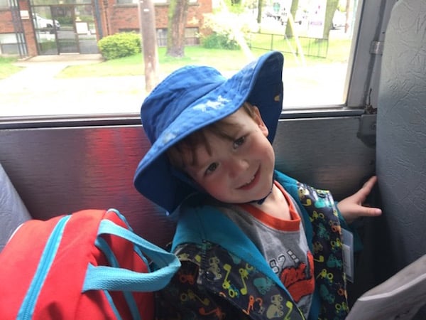 Student smiling on the bus