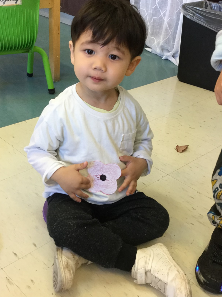 Student with paper poppy