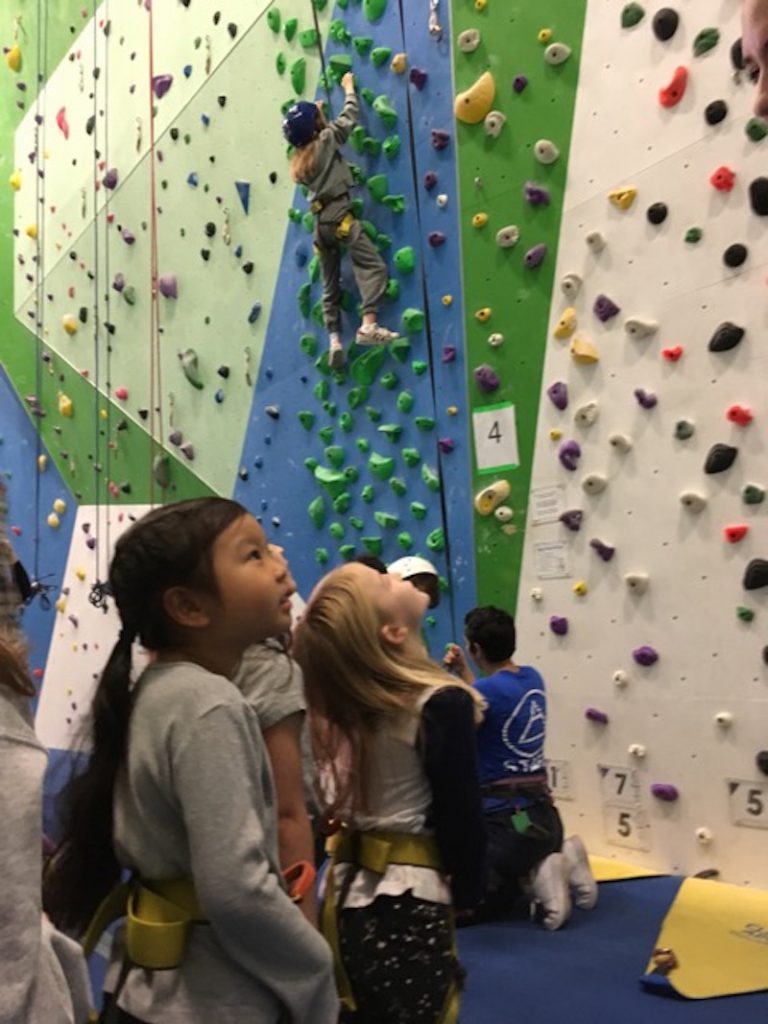 Students watching others climb