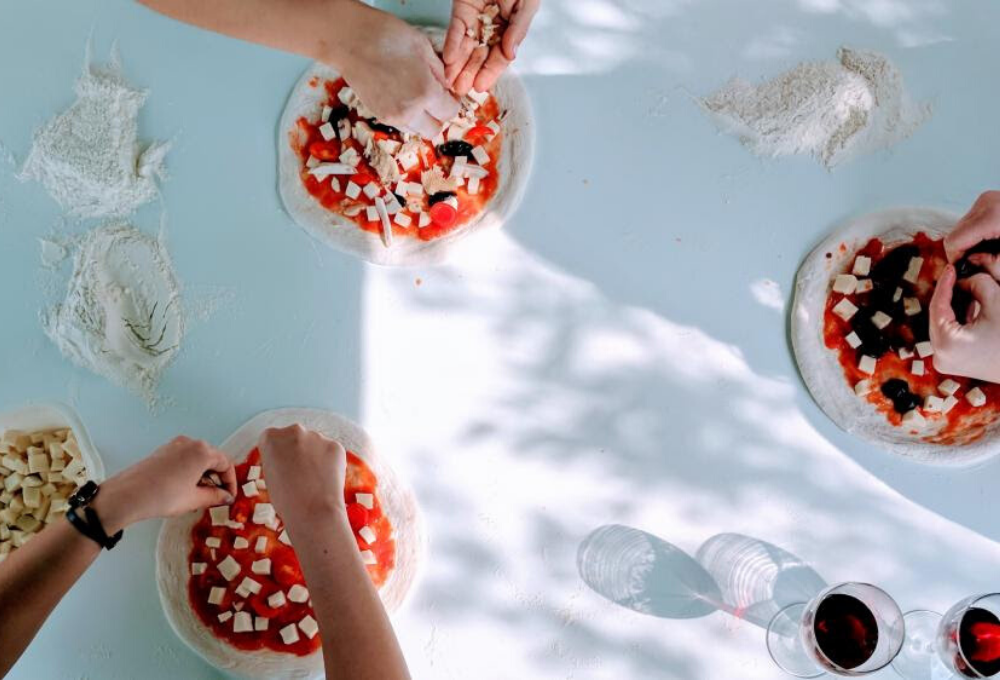 Stock image of people making. pizza