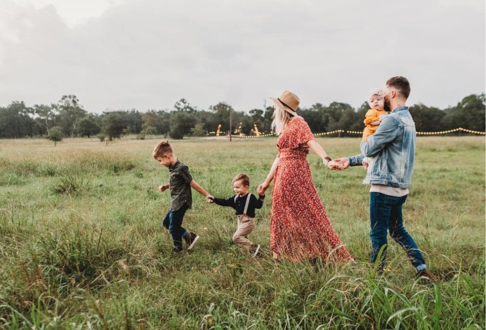 Family walking through grass