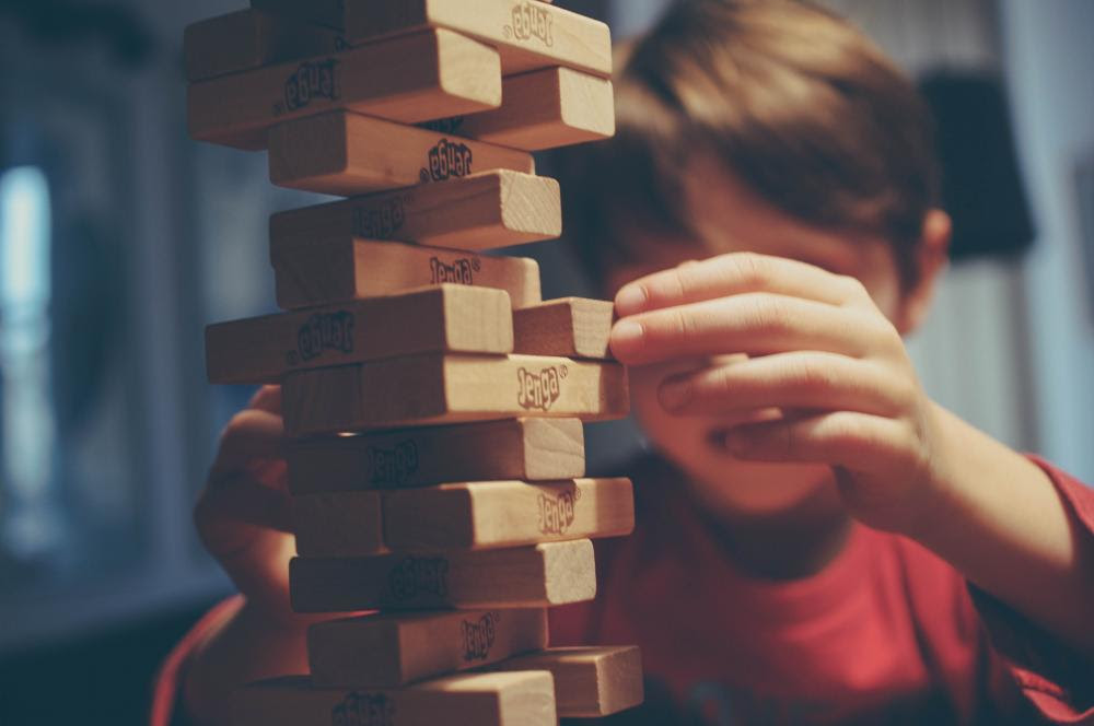 Stock Image of Child playing Jenga