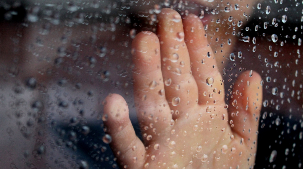 Stock Image of Hand on Glass