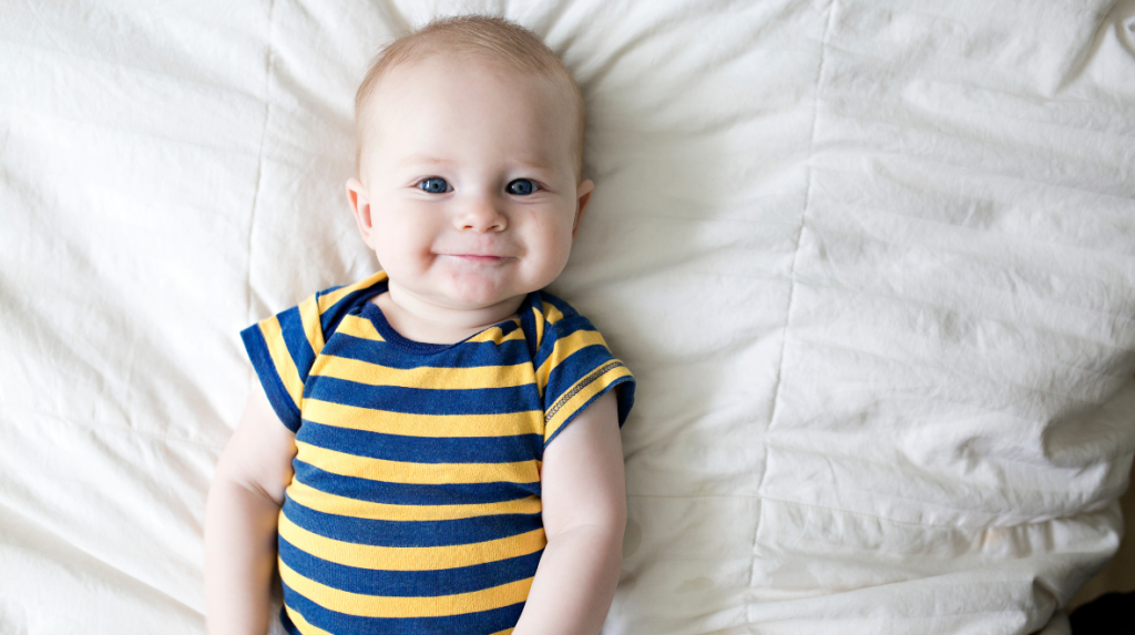 Smiling child on a bed